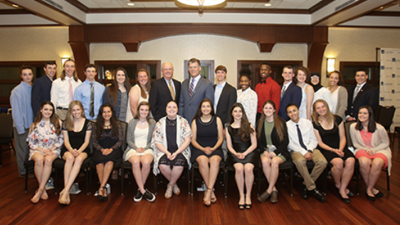 A group of scholarship recipients and WBC employees posing for the camera at an event